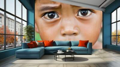 Close-up portrait of young boy with expressive eyes Wall mural