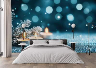 Serene winter holiday scene with lit candles snowy branches Wall mural