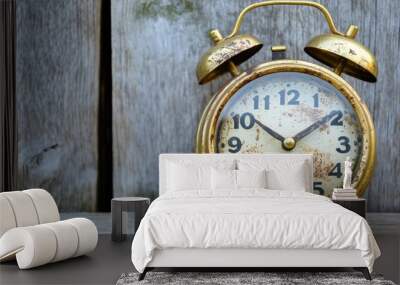 Vintage alarm clock on rustic wooden background Wall mural