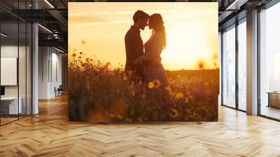 A couple modeling eco-friendly, matching outfits made of organic fabrics, standing together in a field of wildflowers, with a soft, golden sunset in the background Wall mural