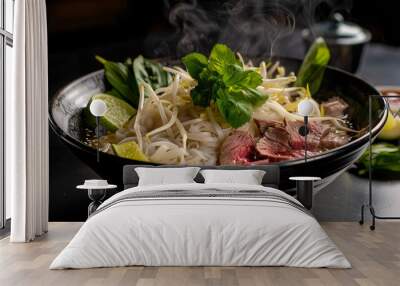 a steaming bowl of pho, featuring rice noodles, thinly sliced beef, bean sprouts, fresh basil, and lime wedges, served in a traditional Vietnamese bowl Wall mural