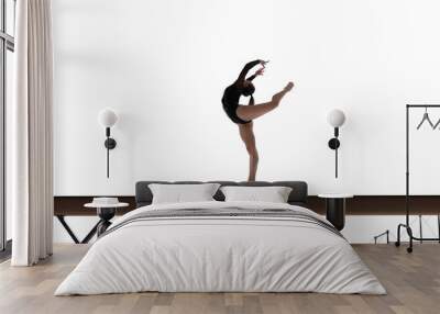 Female gymnast doing a complicated trick isolated on white. Wall mural