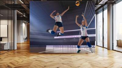 Female professional volleyball players in action on 3d stadium. Wall mural