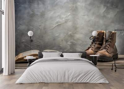 Bible and boots resting on a gray background, faith, inspiration, religious, footwear, shoes, scripture, text, belief, religion Wall mural