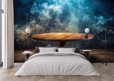 Empty vintage circular wooden table with ethereal smoke floating up against dark background Wall mural