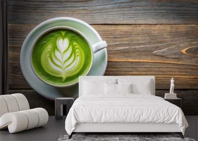 Top view of a delicious matcha green tea latte in a cup with copy space, perfect for a refreshing break or beverage concept Wall mural