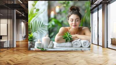 Asian woman enjoys back massage in spa for relaxation and wellness. Wall mural