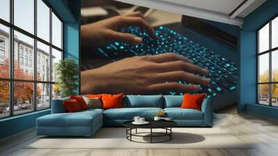 A person's hands are typing on a laptop keyboard, illuminated by the blue glow of the keys Wall mural