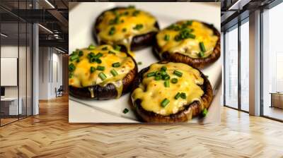 Four grilled mushroom caps are generously topped with melted cheese and chopped green onions, arranged neatly on a white plate in a warm kitchen ambiance Wall mural