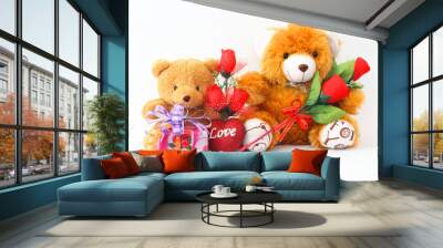 Two brown teddy bear with a red rose and a gift box on a white background. Wall mural