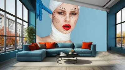 female patient Red lips plastic surgery operation bare shoulders blue background Wall mural