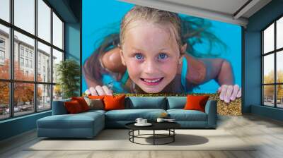 Close up face of a beautiful young girl in the swimming pool. holiday concept Wall mural