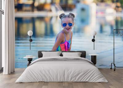 smiling little girl in swimming pool Wall mural