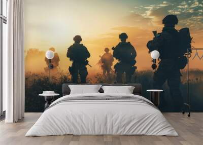 A squad of soldiers advances through a misty field at sunrise, silhouetted against the golden sky, showcasing determination and camaraderie. Wall mural