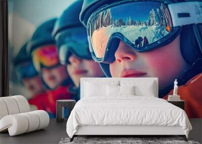 Close-up of a group of children with helmets and sunglasses skiing Wall mural