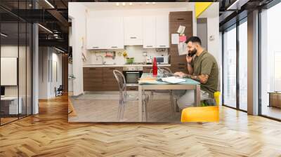 young businessman working from home in casual wear Wall mural