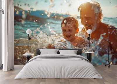 Grandson and grandfather enjoying a day at the beach bathing in the ocean Wall mural