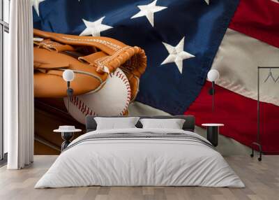 American sports and college athletics concept with the USA flag in the background and macro on a vintage baseball glove holding a ball with copy space Wall mural