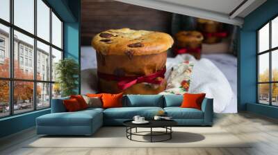 Delicious chocolate panettone for Christmas on white cloth and with space for text.  Wall mural