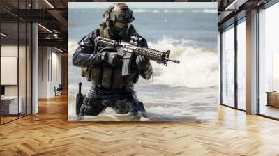 Special forces soldier in combat gear with rifle standing on seashore in full length portrait Wall mural