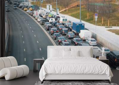 A view to a road with plenty of cars standing at traffic jam on a narrow street in the center of Moscow, Russia. Wall mural