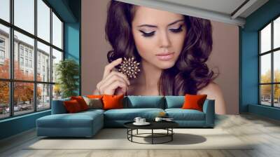 beautiful woman with curly hair and evening make-up. jewelry and Wall mural