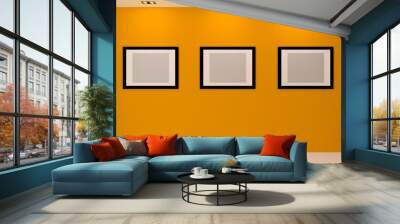 Gallery Interior with empty frames on wall Wall mural