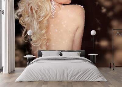 Long curly Hair. Back of slim blond woman wearing in twinkled li Wall mural