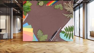 Back to school: composition of school supplies with copy space on a brown background Wall mural