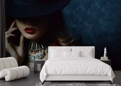 Indoor portrait of a young beautiful  fashionable woman wearing stylish accessories. Hidden eyes with hat. Female fashion, beauty and advertisement concept. Close up. Copy space for text Wall mural