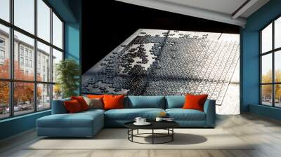 Fragment of jigsaw puzzle game. Black puzzle pieces on the table. Concept of board game Wall mural