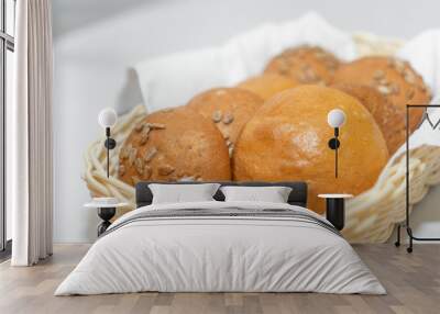 fresh buns in a basket on a white napkin Wall mural