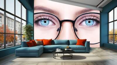 Beautiful young woman wearing glasses. Close-up shot Wall mural