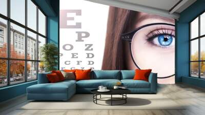 Beautiful young woman wearing glasses. Close-up shot Wall mural