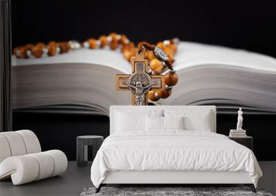 Traditional christian holy religious wooden rosary  with bible on black background Wall mural