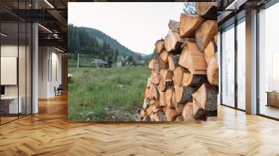 chopped wood firewood in the mountains Wall mural