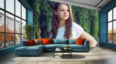 Beautiful smiling girl in white blouse Wall mural