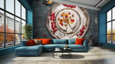 camembert cheese served on a silver platter with berries and honey, top view Wall mural