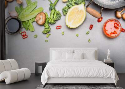 Chinese or Thai cuisine vegetables and spices cooking ingredients on gray stone background, top view, border Wall mural