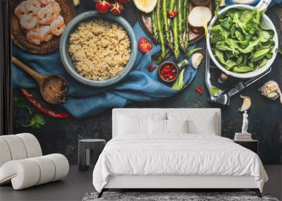 Cooked white quinoa in bowl with fresh vegetables cooking ingredients on dark rustic background, top view, border. Superfood , healthy eating or vegetarian food concept. Wall mural