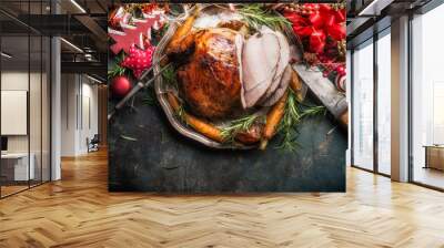 Traditional sliced roasted glazed Christmas ham with holiday festive decoration on dark rustic background, top view, border  Wall mural