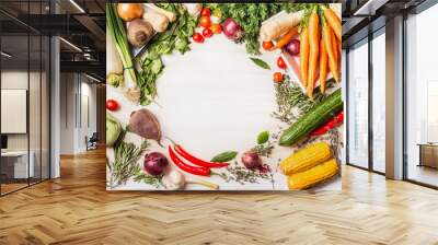 Variety of organic vegetables for tasty vegan or vegetarian cooking on  white wooden background, top view, frame.  Healthy or diet food concept Wall mural