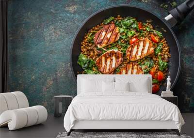 Vegetarian food concept. Healthy lentil dish with spinach and fried  cheese in cooking pan on rustic background with ingredients, top view. Wall mural