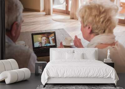 Grandparents cheering to boy over the video call Wall mural