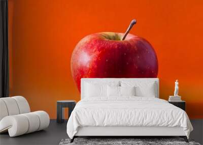 red apple on a red background Wall mural