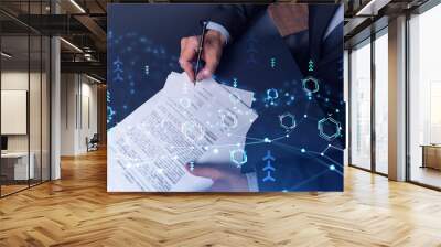 A client in dark blue suit is signing a contract to create a new software to present it in start up conference and gain investments to create a product. Technological graph over the desk. Wall mural