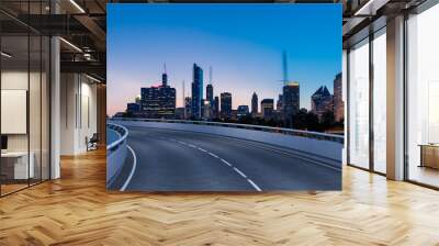 Empty urban asphalt road exterior with city buildings background. New modern highway concrete construction. Concept of way to success. Transportation logistic industry fast delivery. Chicago. USA. Wall mural