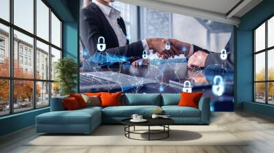 Handshake of two businesspeople who are negotiated the project to protect cyber security of international company. Padlock Hologram icons. Woman in business. Wall mural