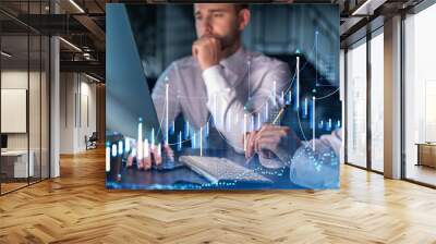 Two colleagues in formal wear working together to optimize trading strategy at corporate finance fund. Forex chart hologram over modern office background Wall mural