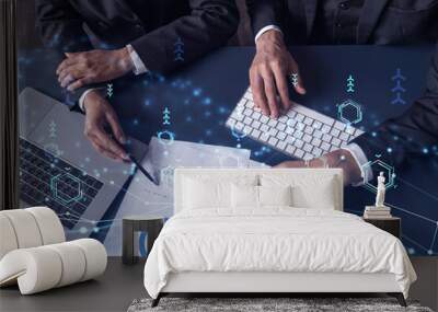 Two research and development specialists man and woman working on project to create a new approach to develop software to improve business. Technological icons over the table with document. Wall mural